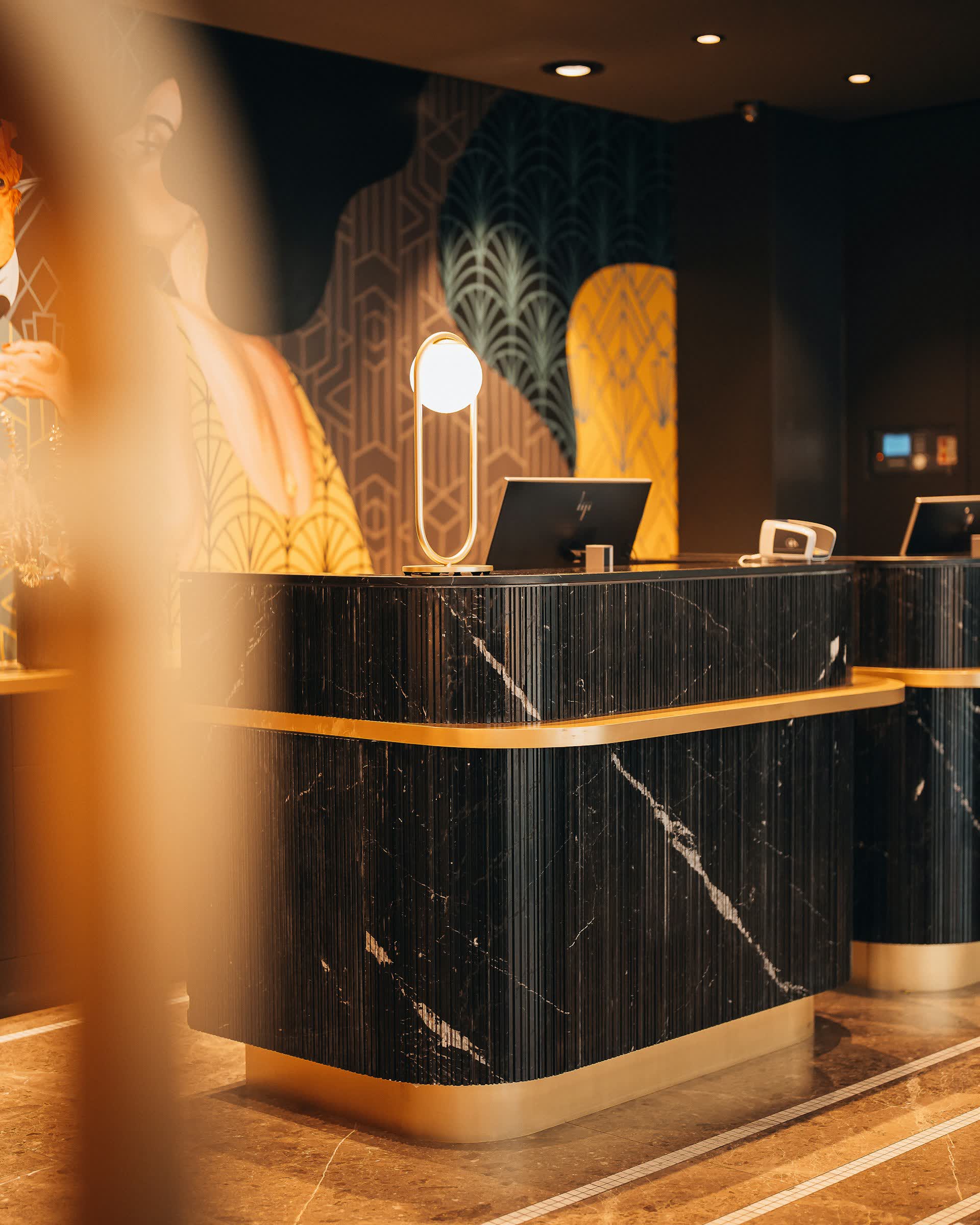 An empty hotel reception desk glowing at night